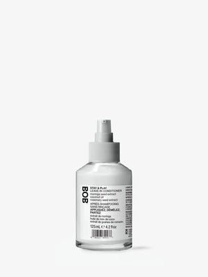 Stay & Play leave-in conditioner bottle for hair hydration and detangling.