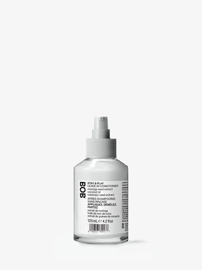 Stay & Play leave-in conditioner bottle for hair hydration and detangling.
